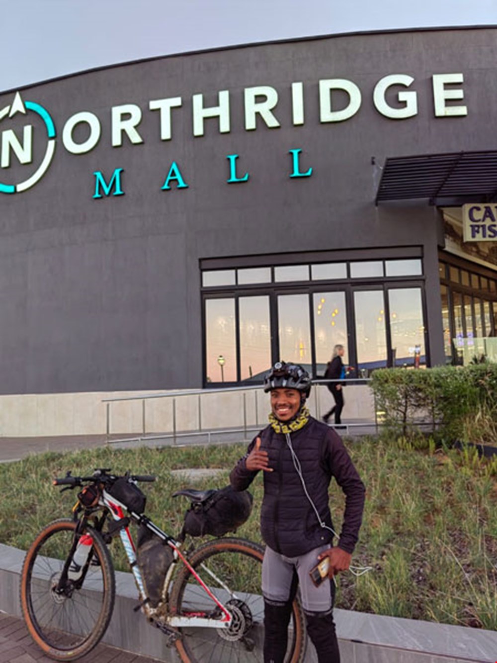 CUT cycle club member riding his bicycle from Johannesburg to Cape Town for kids without school shoes