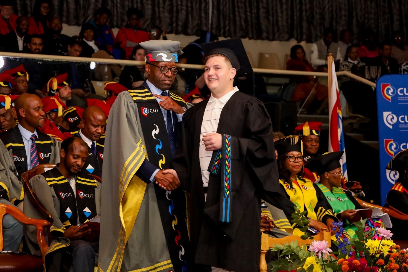 He was told he would never graduate. Theron proved them wrong